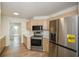 Modern kitchen with stainless steel appliances and light beige cabinets at 1666 Paddlewheel Dr, Marietta, GA 30062