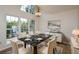 Bright dining room with marble table, chandelier, and large windows at 1666 Paddlewheel Dr, Marietta, GA 30062