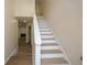Beige and white staircase leading to the upper level at 1666 Paddlewheel Dr, Marietta, GA 30062