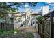 Back deck with fenced yard and partial view of neighboring townhouses at 1666 Paddlewheel Dr, Marietta, GA 30062