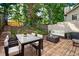 Relaxing backyard with deck, patio furniture, and lush landscaping at 1666 Paddlewheel Dr, Marietta, GA 30062