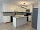 Renovated kitchen features granite countertops and white cabinets at 6209 Southland Forest Dr, Stone Mountain, GA 30087