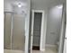 Bathroom with shower, linen closet, and hexagon tile floor at 6209 Southland Forest Dr, Stone Mountain, GA 30087