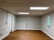 Spacious finished basement room with large window and door access at 6209 Southland Forest Dr, Stone Mountain, GA 30087