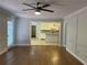 Living room with hardwood floors and view of kitchen at 6209 Southland Forest Dr, Stone Mountain, GA 30087