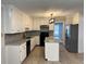 Renovated kitchen features granite countertops and white cabinets at 6209 Southland Forest Dr, Stone Mountain, GA 30087