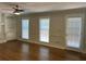 Spacious living room with hardwood floors and built-in shelving at 6209 Southland Forest Dr, Stone Mountain, GA 30087
