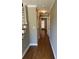 Hardwood floor hallway with doors to other rooms at 6209 Southland Forest Dr, Stone Mountain, GA 30087