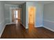 Living room with hardwood floors and access to a bathroom at 6209 Southland Forest Dr, Stone Mountain, GA 30087