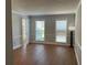 Bright living room with hardwood floors and neutral walls at 6209 Southland Forest Dr, Stone Mountain, GA 30087