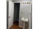 Basement bathroom with pedestal sink at 6209 Southland Forest Dr, Stone Mountain, GA 30087