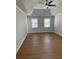 Bright and spacious bedroom with hardwood floors and tray ceiling at 6209 Southland Forest Dr, Stone Mountain, GA 30087