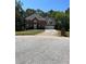 Two story brick home with attached garage at 6209 Southland Forest Dr, Stone Mountain, GA 30087