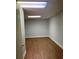 Finished basement room with laminate wood flooring at 6209 Southland Forest Dr, Stone Mountain, GA 30087