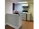 Efficient basement kitchen featuring white cabinets and modern appliances at 6209 Southland Forest Dr, Stone Mountain, GA 30087