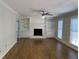 Living room with hardwood floors, fireplace and built-in shelving at 6209 Southland Forest Dr, Stone Mountain, GA 30087