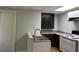 Basement kitchen with dark cabinets and a double sink at 6209 Southland Forest Dr, Stone Mountain, GA 30087