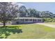 Gray brick ranch house with a white porch and landscaped lawn at 602 Jackie Ln, Villa Rica, GA 30180