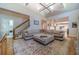 Open living room with vaulted ceiling, comfortable seating, and views to kitchen at 990 Bramlett Shoals Rd, Lawrenceville, GA 30045