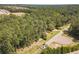 Aerial view of property with wooded lot and neighborhood in the background at 990 Bramlett Shoals Rd, Lawrenceville, GA 30045