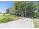Long driveway with a tree-lined entrance at 990 Bramlett Shoals Rd, Lawrenceville, GA 30045