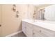 Clean bathroom with white vanity, mirror, and carpeted floor at 990 Bramlett Shoals Rd, Lawrenceville, GA 30045
