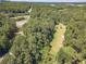 Aerial view of wooded lot near highway at 990 Bramlett Shoals Rd, Lawrenceville, GA 30045