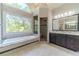 Elegant bathroom with double vanity, soaking tub, and walk-in shower at 990 Bramlett Shoals Rd, Lawrenceville, GA 30045