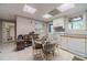 Basement kitchenette with white cabinets and dining area at 990 Bramlett Shoals Rd, Lawrenceville, GA 30045