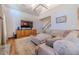Spacious living room featuring a large sectional sofa and a beautiful stone fireplace at 990 Bramlett Shoals Rd, Lawrenceville, GA 30045