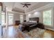 Luxurious main bedroom with hardwood floors and ample natural light at 990 Bramlett Shoals Rd, Lawrenceville, GA 30045