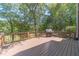 Spacious deck with grill, overlooking a wooded area at 990 Bramlett Shoals Rd, Lawrenceville, GA 30045