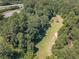Aerial view of wooded lot near highway at 990 Bramlett Shoals Rd, Lawrenceville, GA 30045