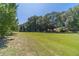 Expansive backyard with a view of the home at 990 Bramlett Shoals Rd, Lawrenceville, GA 30045