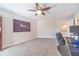 Bedroom with a workspace, carpeted floor, and access to the upstairs hallway at 990 Bramlett Shoals Rd, Lawrenceville, GA 30045