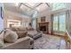 Open concept living room with a cozy fireplace and views into the kitchen at 990 Bramlett Shoals Rd, Lawrenceville, GA 30045