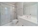Bright bathroom with a shower/tub combo and updated vanity at 990 Bramlett Shoals Rd, Lawrenceville, GA 30045
