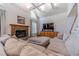 Spacious living room with hardwood floors, fireplace and large sectional sofa at 990 Bramlett Shoals Rd, Lawrenceville, GA 30045