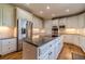 Spacious kitchen with granite countertops, stainless steel appliances and hardwood floors at 990 Bramlett Shoals Rd, Lawrenceville, GA 30045