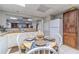 Bright, finished basement kitchen with white cabinets and a small dining area at 990 Bramlett Shoals Rd, Lawrenceville, GA 30045