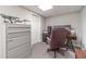 Finished basement office space with a desk, chair, and ample storage at 990 Bramlett Shoals Rd, Lawrenceville, GA 30045
