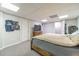 Spacious basement bedroom with a king-size bed and plenty of space at 990 Bramlett Shoals Rd, Lawrenceville, GA 30045