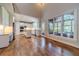 Open concept living room and kitchen with hardwood floors and high ceilings at 990 Bramlett Shoals Rd, Lawrenceville, GA 30045