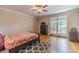 Spacious bedroom with hardwood floors, ceiling fan, and ample natural light at 990 Bramlett Shoals Rd, Lawrenceville, GA 30045