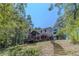 Two story home with deck and screened porch, steps leading to the house at 990 Bramlett Shoals Rd, Lawrenceville, GA 30045