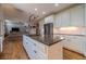 Open concept kitchen with large island, granite countertops and stainless steel appliances at 990 Bramlett Shoals Rd, Lawrenceville, GA 30045