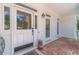 Inviting front entrance with a brick walkway and white front door at 990 Bramlett Shoals Rd, Lawrenceville, GA 30045
