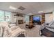 Finished basement boasts a large TV, fireplace, and ample seating at 990 Bramlett Shoals Rd, Lawrenceville, GA 30045