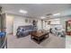 Spacious finished basement offers living area with multiple seating options at 990 Bramlett Shoals Rd, Lawrenceville, GA 30045