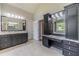 Spa-like bathroom with double vanity and a large soaking tub at 990 Bramlett Shoals Rd, Lawrenceville, GA 30045